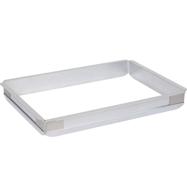 A rectangular metal tray with a silver Baker's Mark pan extender on it.