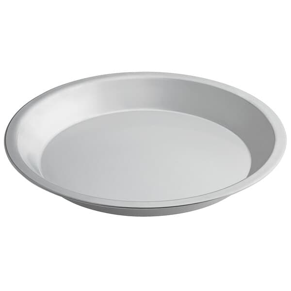 A close-up of a Baker's Mark white aluminum pie pan.