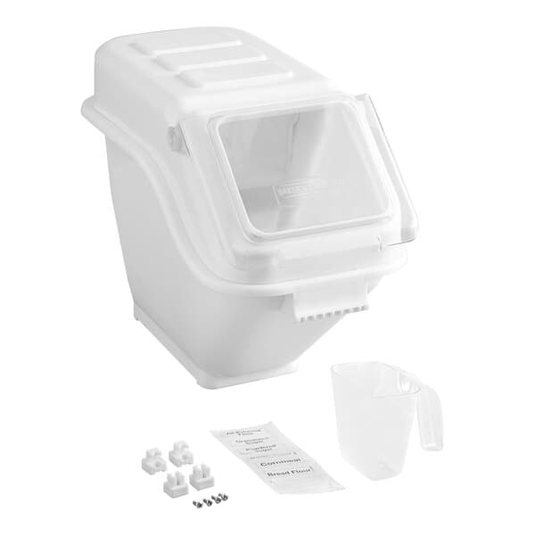 A white container with a clear lid and a measuring cup.