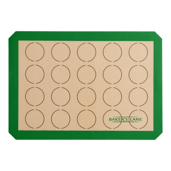 A Baker's Lane green silicone baking mat with brown circles.