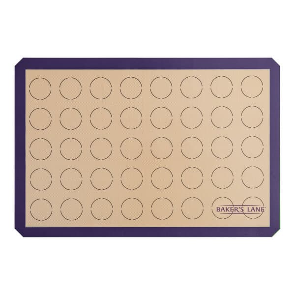 A purple Baker's Lane silicone baking mat with circles for macarons.