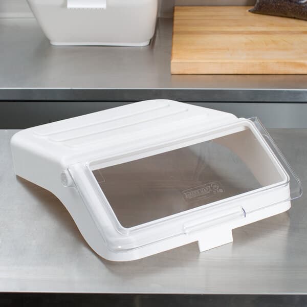 A Baker's Mark clear lid on a white plastic container.