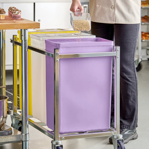 A purple 10-gallon ingredient bin on a metal cart, designed for allergen-free storage.
