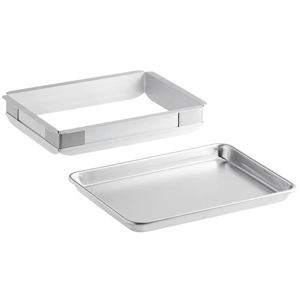 A Baker's Mark quarter sheet cake pan with a metal extender frame on top.
