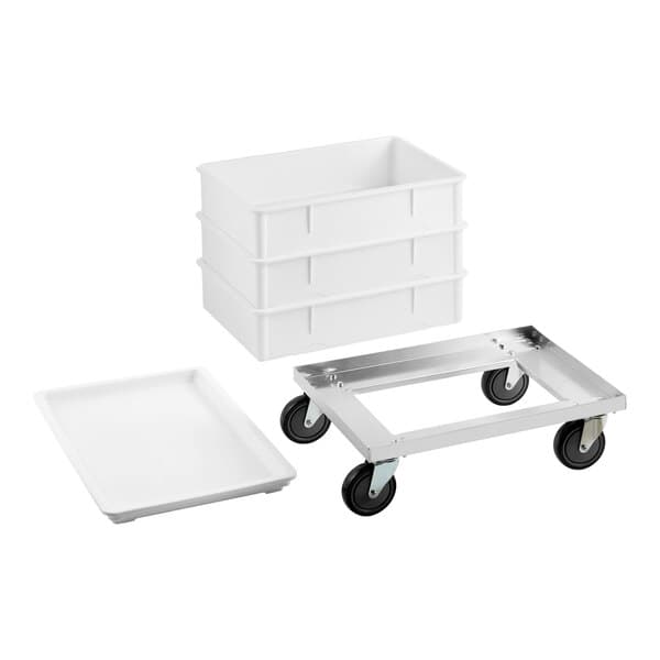 A white dough proofing set including three rectangular proofing boxes, a matching lid, and an aluminum dolly with four wheels.