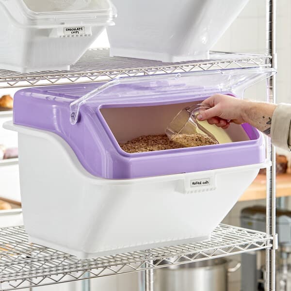 A large white and purple ingredient bin with a flip lid, label, and scoop, designed for allergen-free storage on a wire shelf.