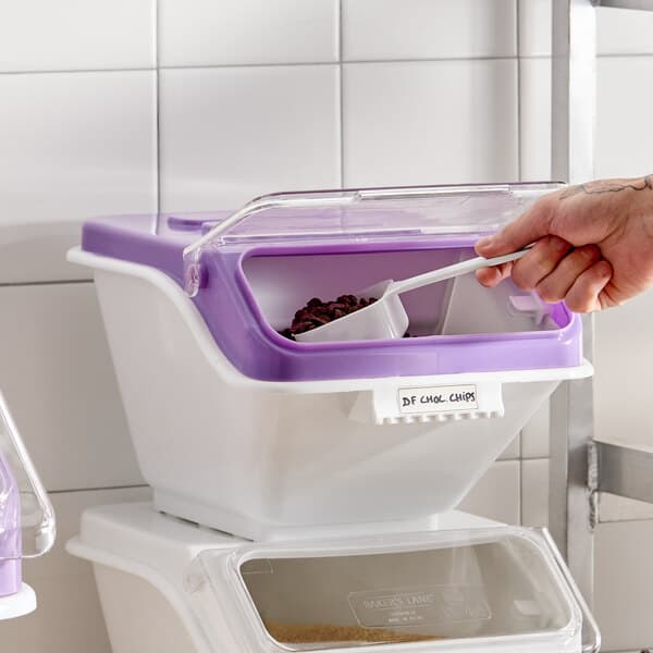A white and purple ingredient bin with a flip lid, label sheet, and scoop, used for allergen-free storage.