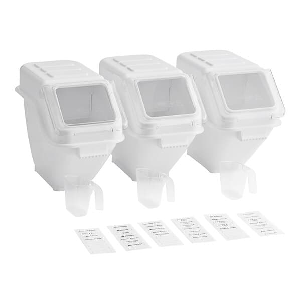 A group of white Baker's Lane ingredient shelf bins with clear windows and labels on them.