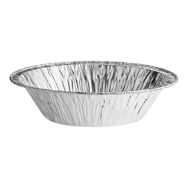 A close-up of a round silver Baker's Lane foil tart pan.