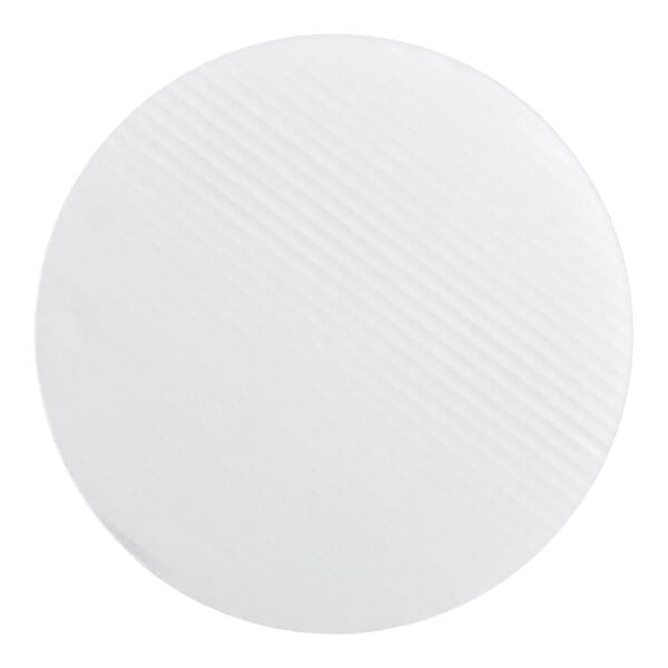 A round, white, corrugated grease-resistant cake circle.