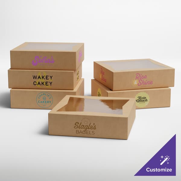 A set of customizable kraft bakery boxes with clear window tops, designed for packaging pies or baked goods.