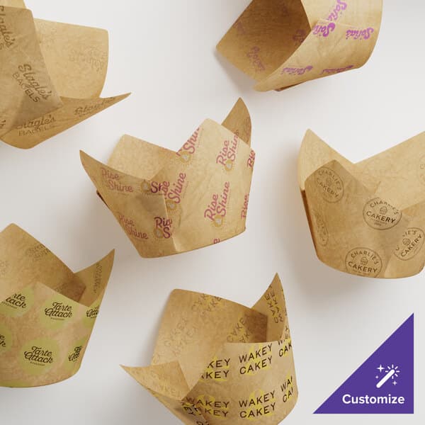 A group of Baker's Lane brown paper tulip baking cups with different designs.