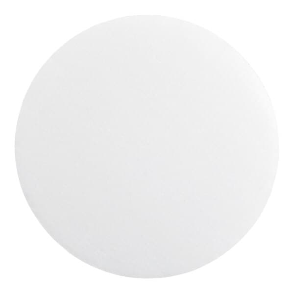 A round, white, corrugated grease-resistant cake circle.