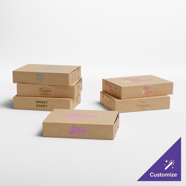 A group of Baker's Lane bakery boxes with text and logos in different colors.