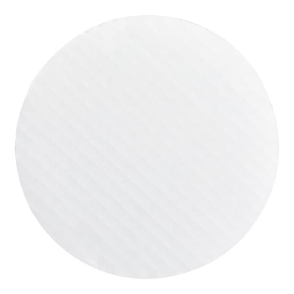 A round, white, corrugated grease-resistant cake circle.