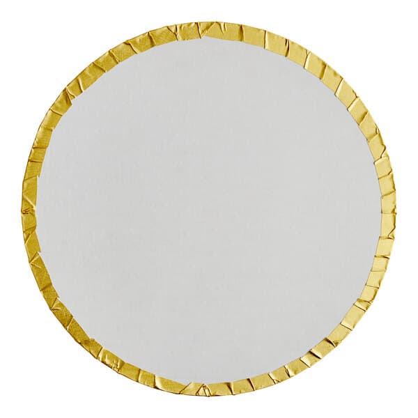 A round white cake drum with gold trim.
