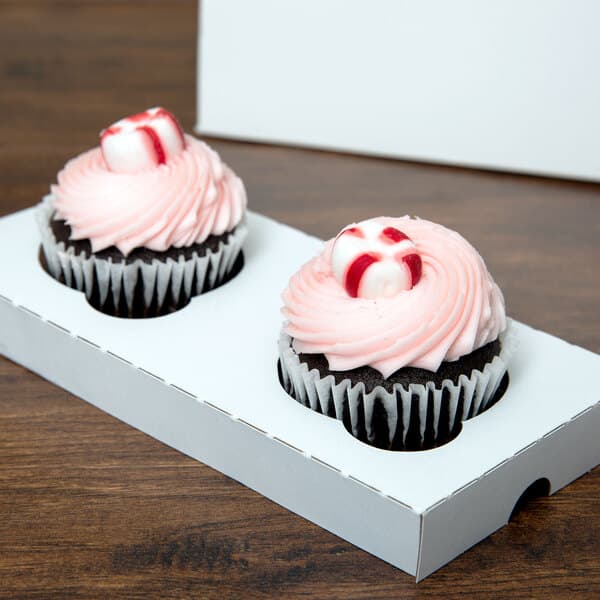 A Baker's Lane reversible cupcake insert holding two cupcakes in a white box.