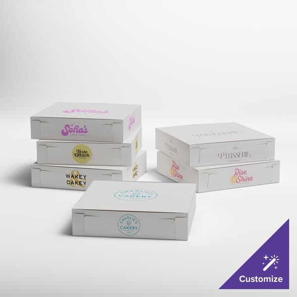 A set of white customizable bakery boxes with various printed logos and designs, suitable for pies or baked goods.
