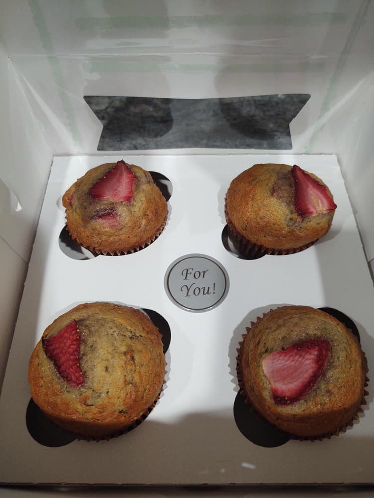 Strawberry banana muffins for a customer.