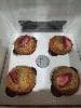 Strawberry banana muffins for a customer.